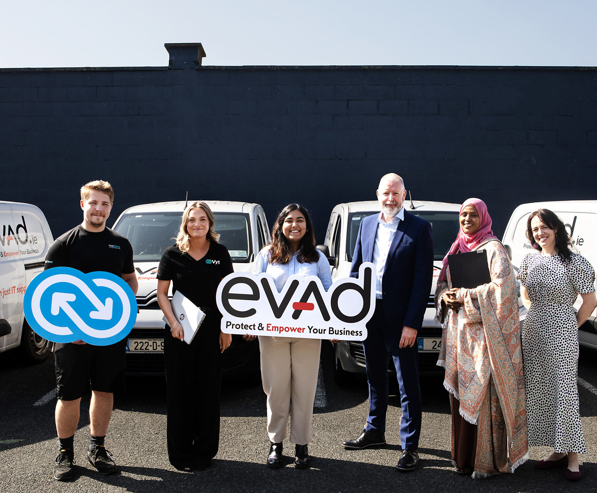 Group photo marking the laptop donation to the Ifrah Foundation.